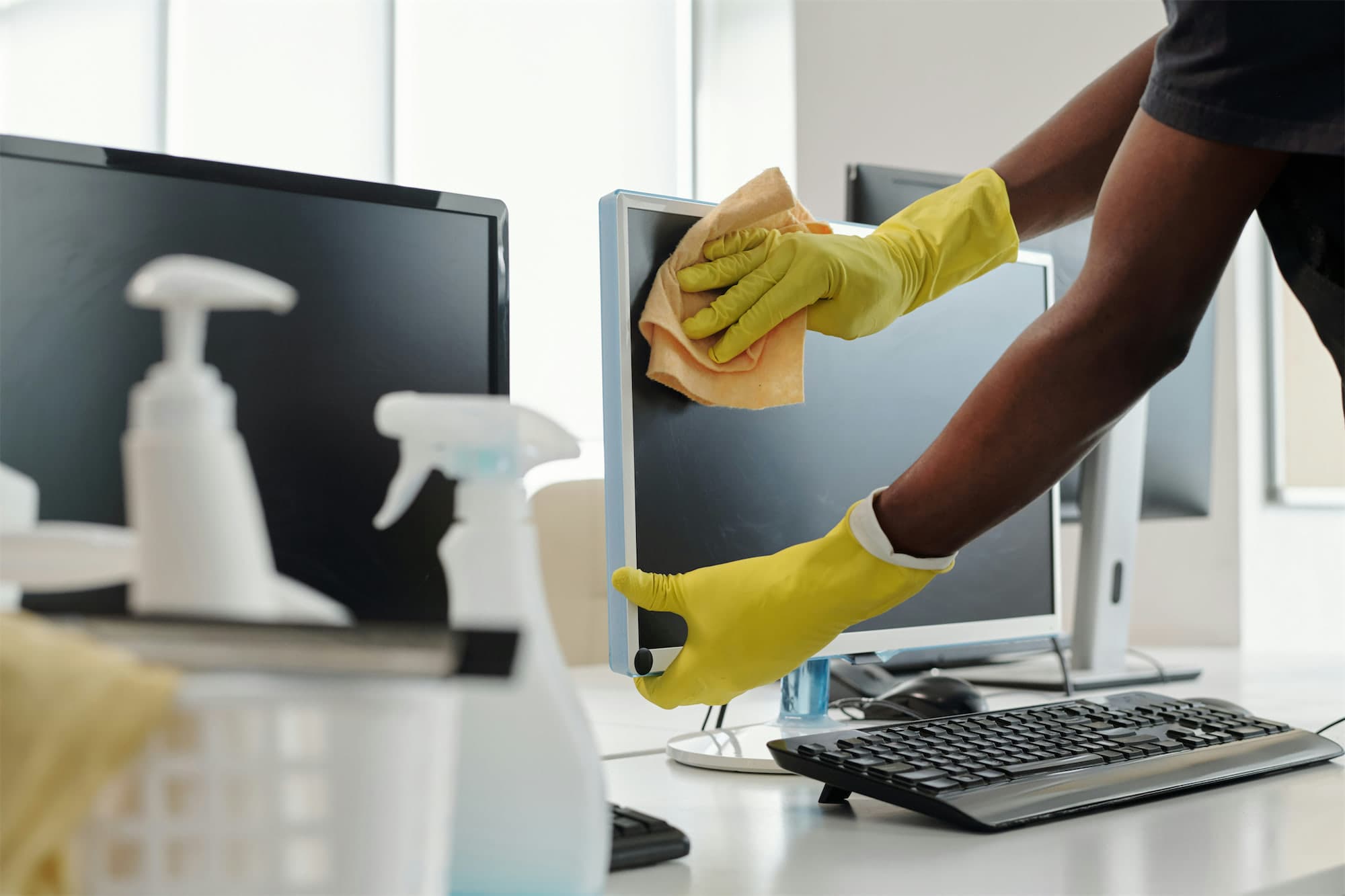 An office workstation being detailed and sanitized